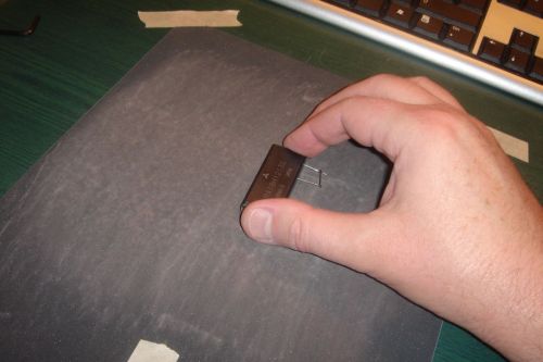 Sanding the bottom side of the power module.